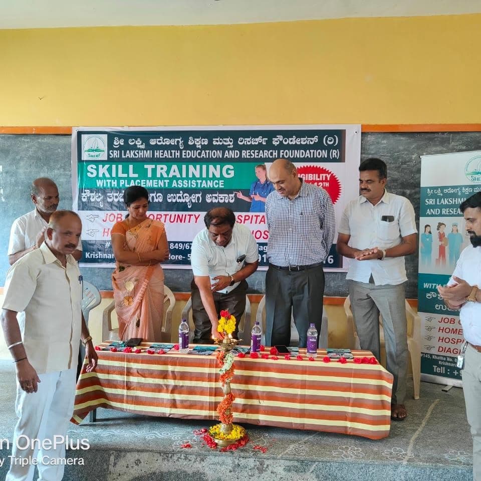 Dignitaries lighting a ceremonial lamp at the inauguration of a Skill Training with Placement Assistance programme by the Sri Lakshmi Health Education and Research Foundation.